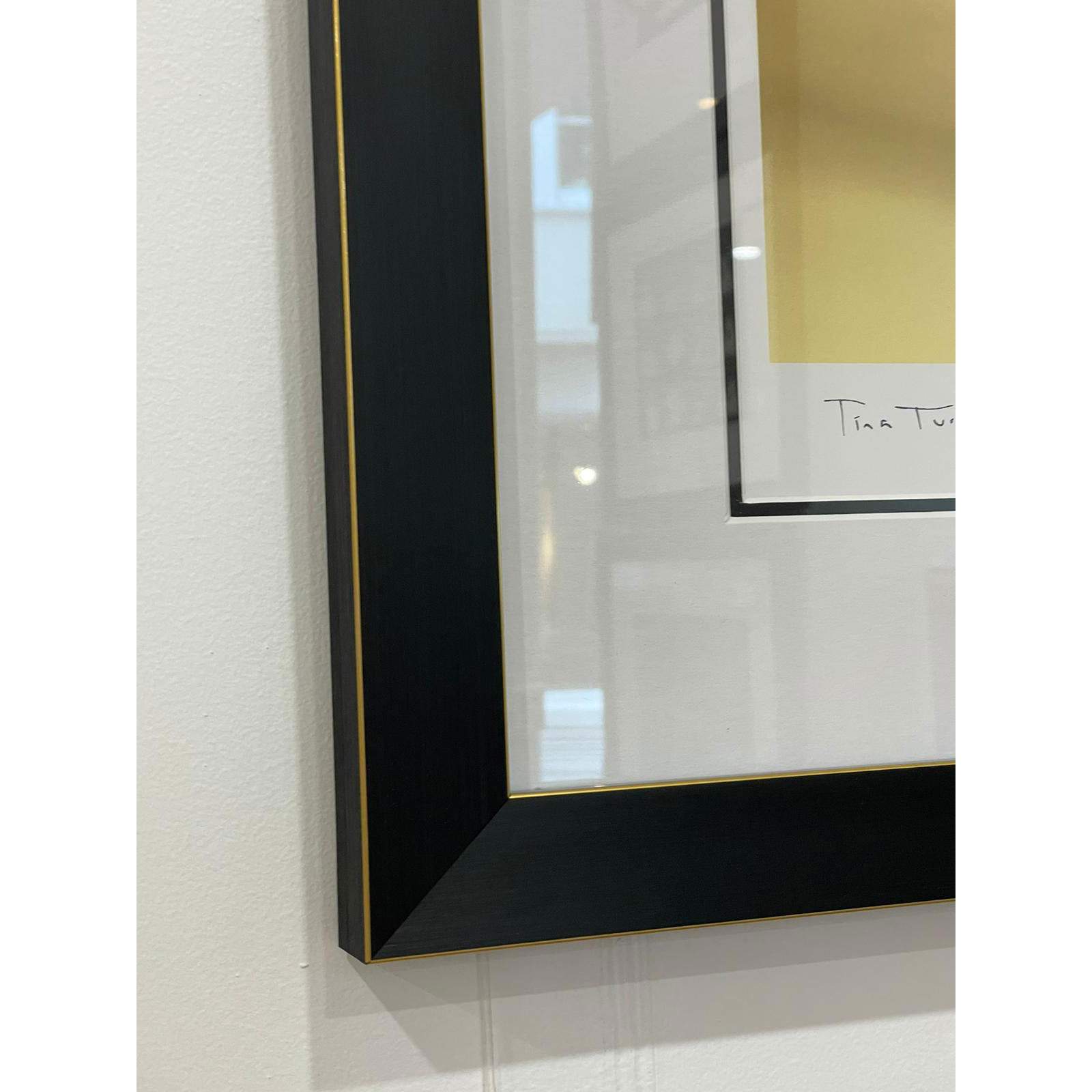 Tina Turner - limited edition print by Brian Aris presented in a black and gold frame