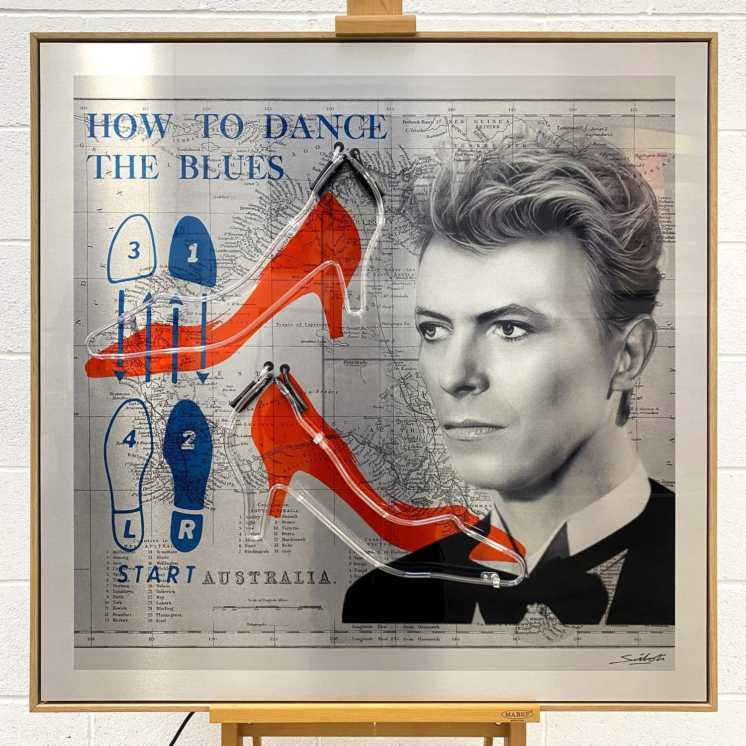 david bowie art in frame with red shoes