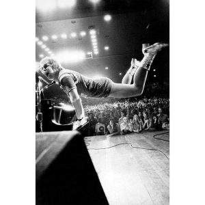 Elton John takes flight, 1970 — Limited Edition Print by Ed Caraeff